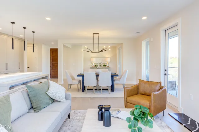 a kitchen with stainless steel appliances kitchen island a white stove top oven and sink