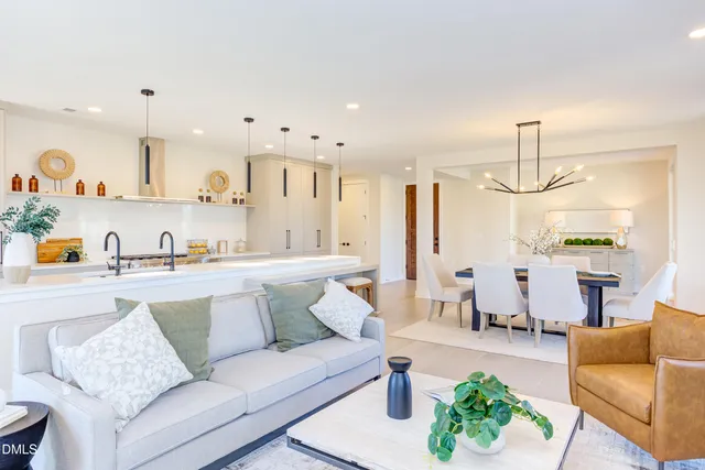 a kitchen with stainless steel appliances a sink and a stove top oven