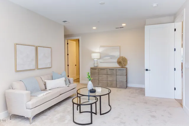 a living room with a couch and a swing