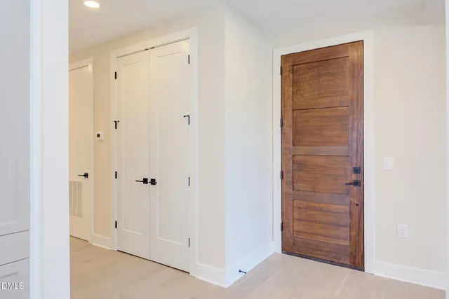a living room with furniture a fireplace and a chandelier