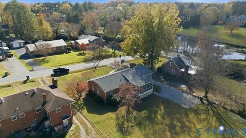 a view of a swimming pool with outdoor seating and a mountain view