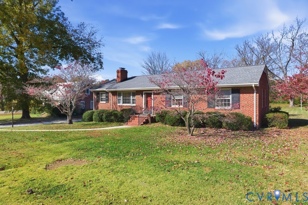 2206 Valentine Road Henrico, VA 23228 - Photo 5 of 45 a front view of a house with a yard