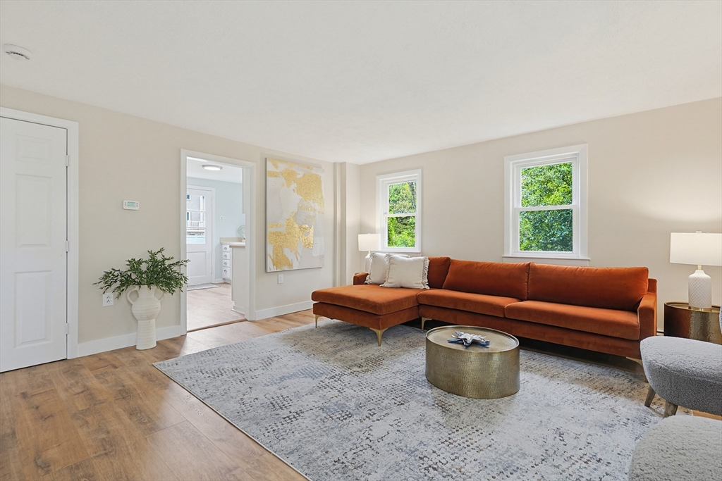 24 Otis Road Barnstable, MA 02601 - Photo 3 of 33 a living room with furniture and a potted plant