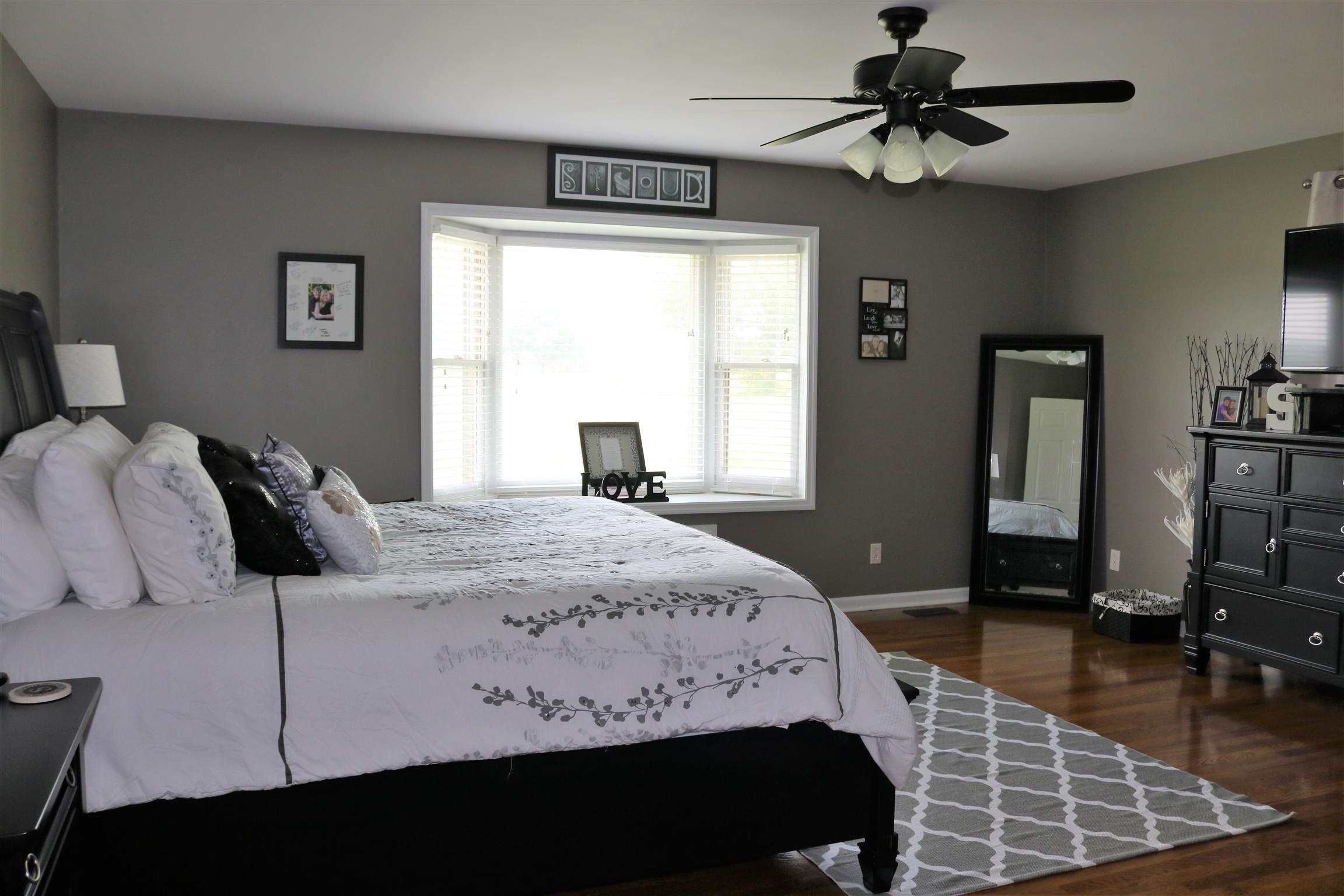 5937 Lakeview Road Springfield, TN 37172 - Photo 21 of 26 a bedroom with a bed a dresser and a window