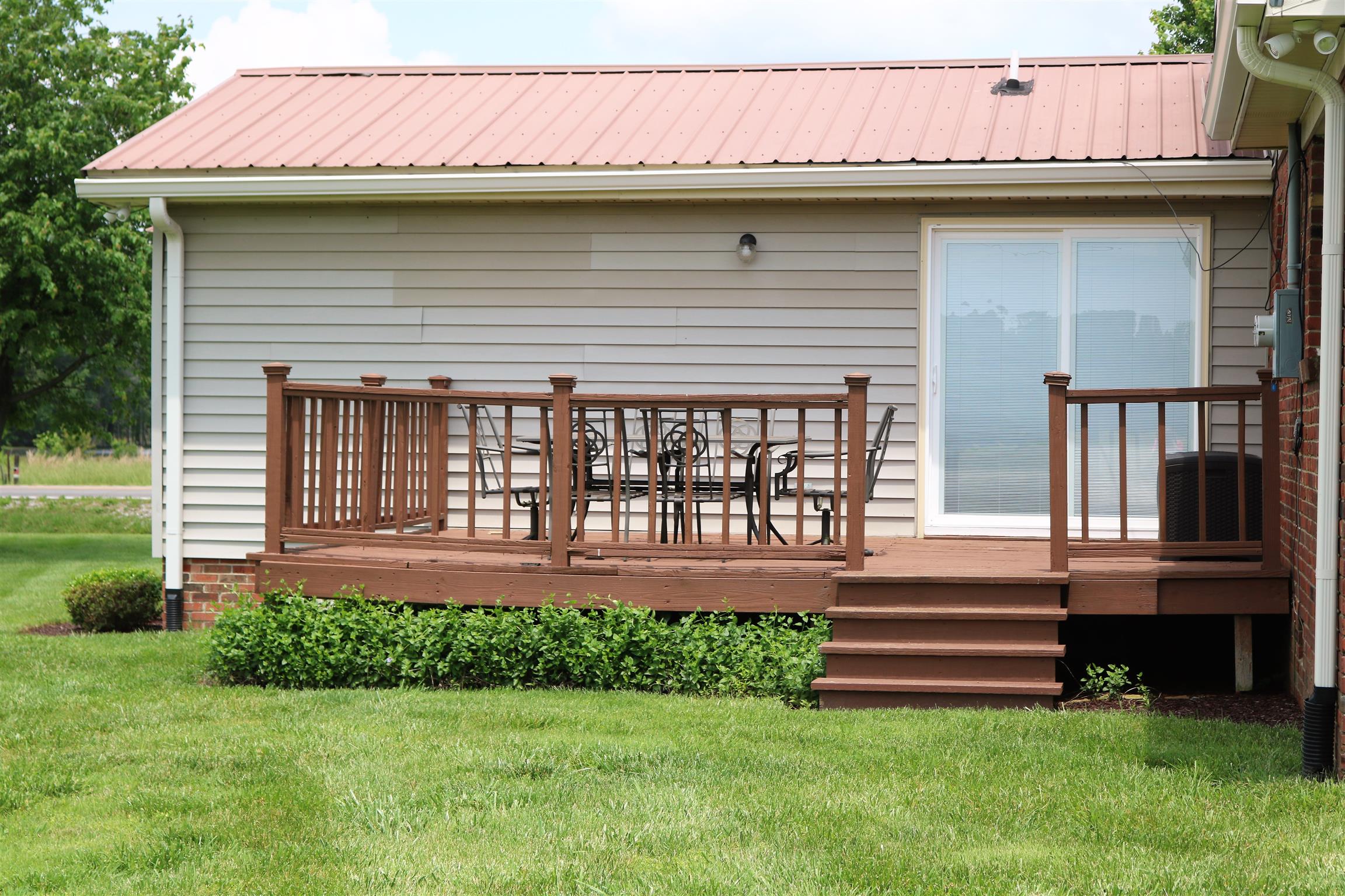 5937 Lakeview Road Springfield, TN 37172 - Photo 4 of 26 a front view of a house with a garden and yard