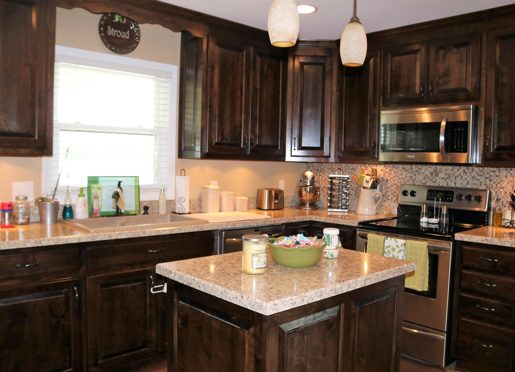 5937 Lakeview Road Springfield, TN 37172 - Photo 7 of 26 a kitchen with a sink a microwave and cabinets