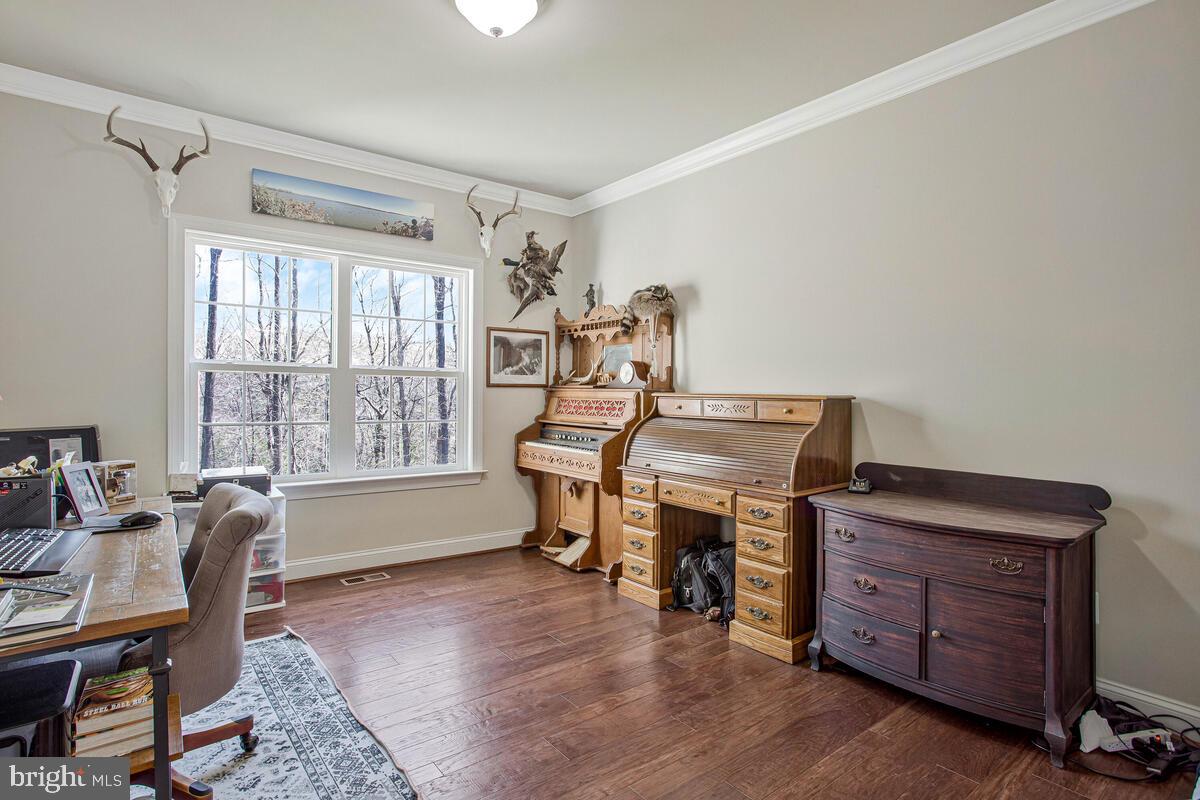 54 Simmons Ridge Road Prince Frederick, MD 20678 - Photo 11 of 55 a view of a workspace with furniture and a window