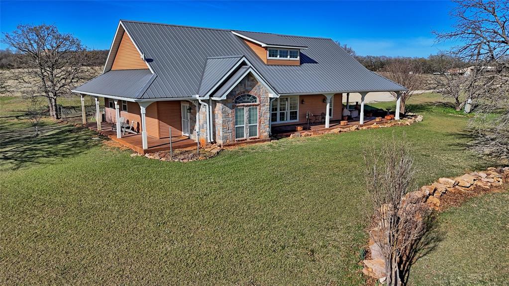 4460 Hildreth Pool Road Bowie, TX 76230 - Photo 29 of 40 a house with green field in front of it
