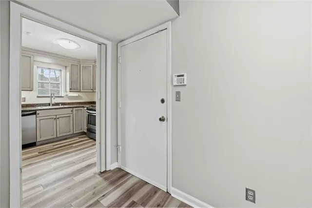 a view of a kitchen from the hallway