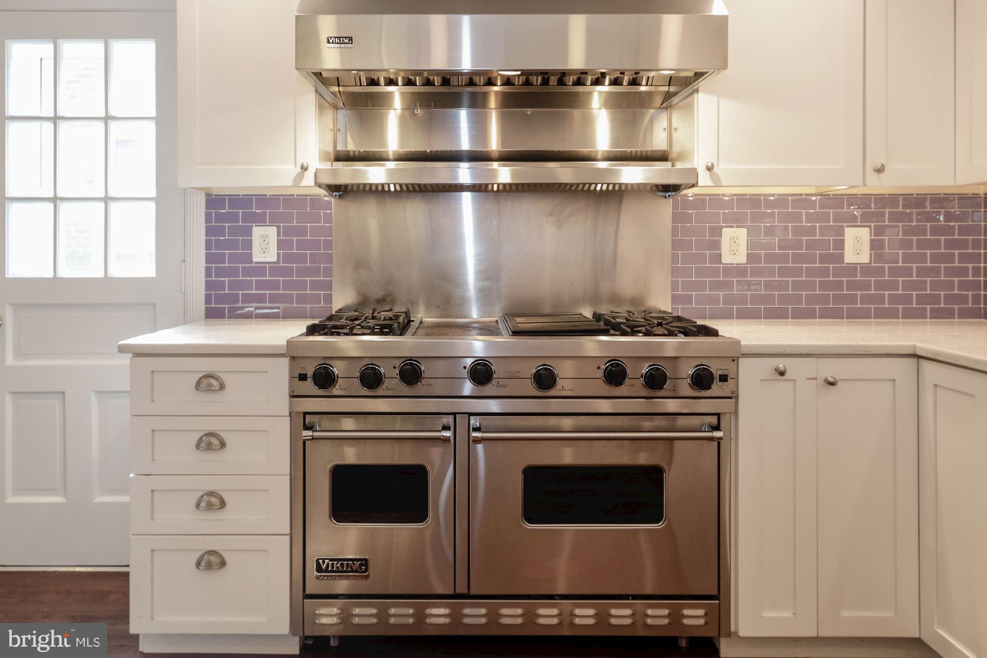 4767 Berkeley Terrace Northwest Washington, DC 20007 - Photo 11 of 30 a stove top oven sitting inside of a kitchen