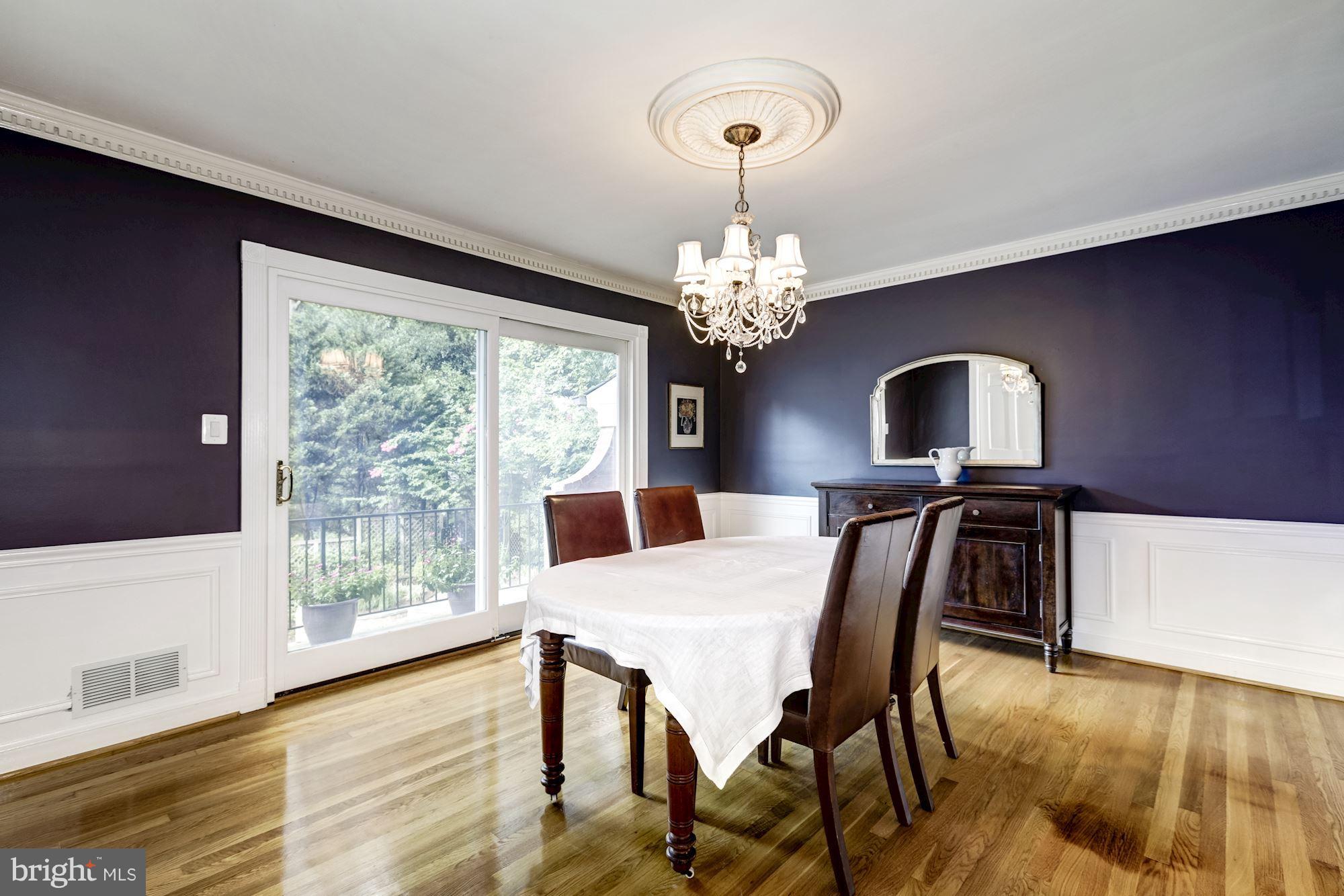 4767 Berkeley Terrace Northwest Washington, DC 20007 - Photo 12 of 30 a view of a dining room with furniture window and wooden floor