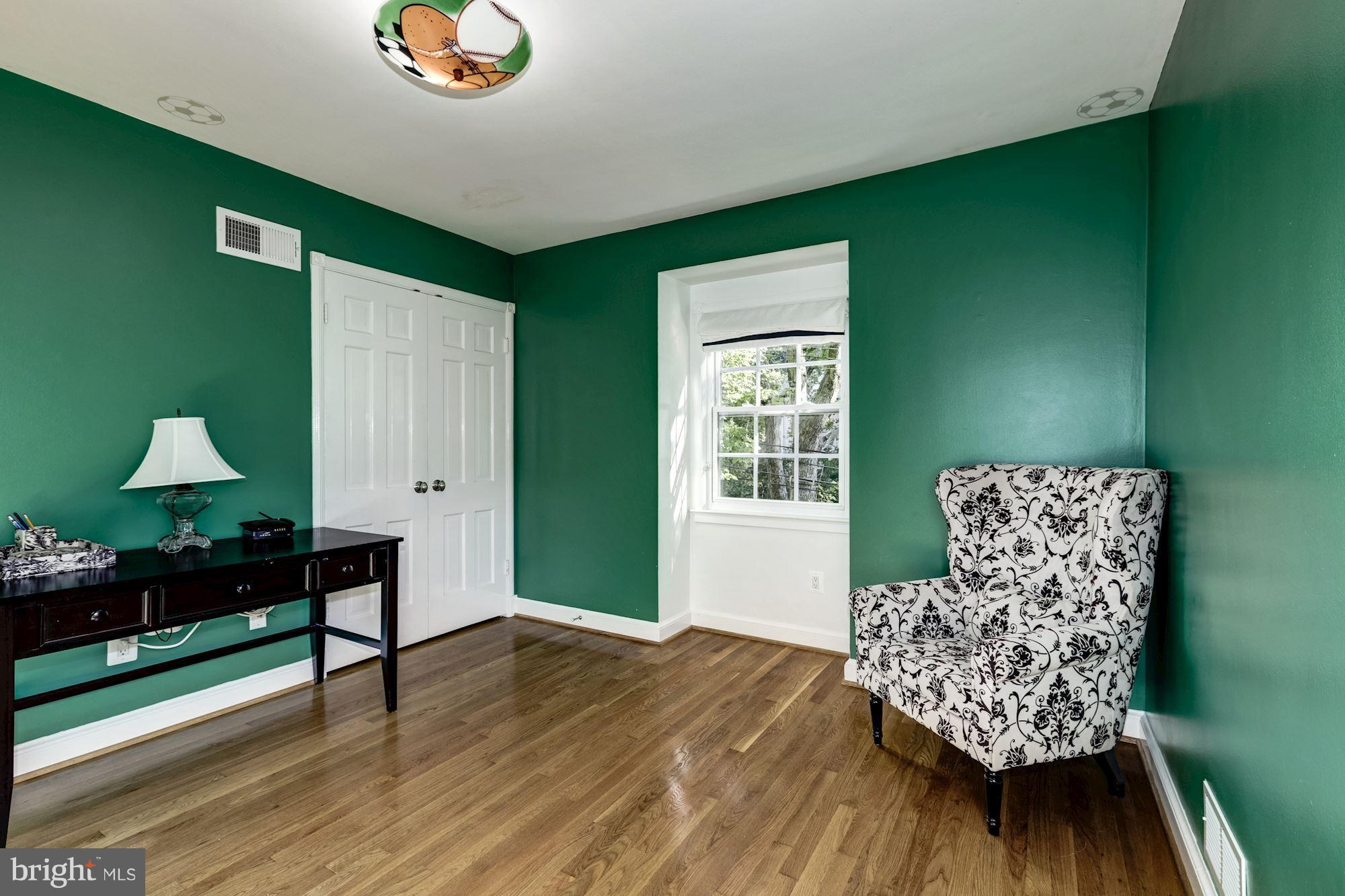 4767 Berkeley Terrace Northwest Washington, DC 20007 - Photo 20 of 30 a living room with furniture and a window