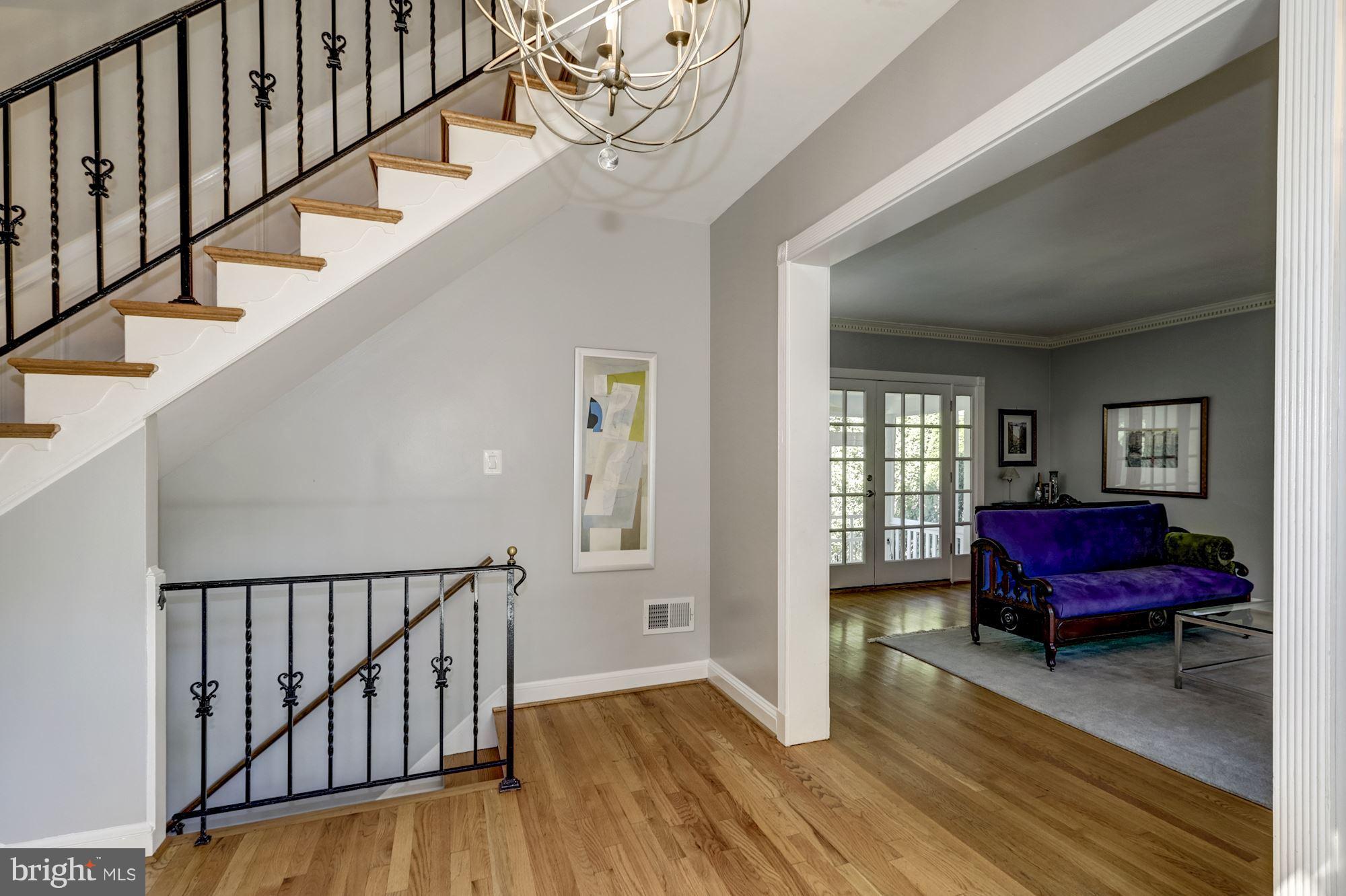 4767 Berkeley Terrace Northwest Washington, DC 20007 - Photo 3 of 30 a view of a hallway with wooden floor and stairs
