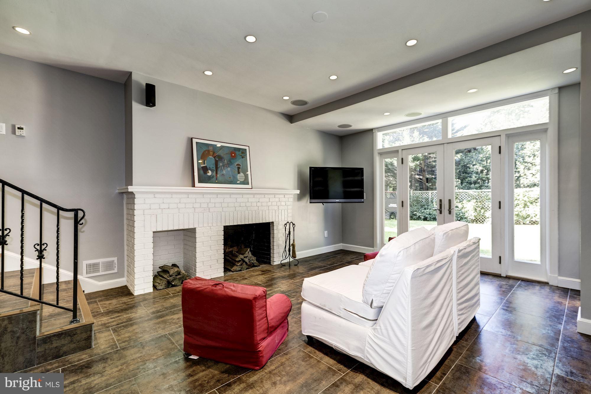 4767 Berkeley Terrace Northwest Washington, DC 20007 - Photo 24 of 30 a living room with furniture fireplace and flat screen tv