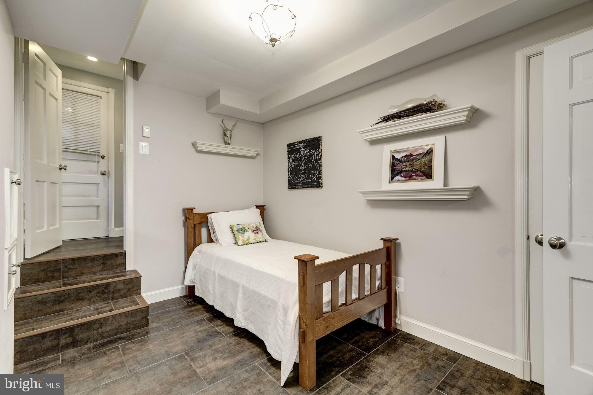 4767 Berkeley Terrace Northwest Washington, DC 20007 - Photo 26 of 30 a bed room with a bed and a painting