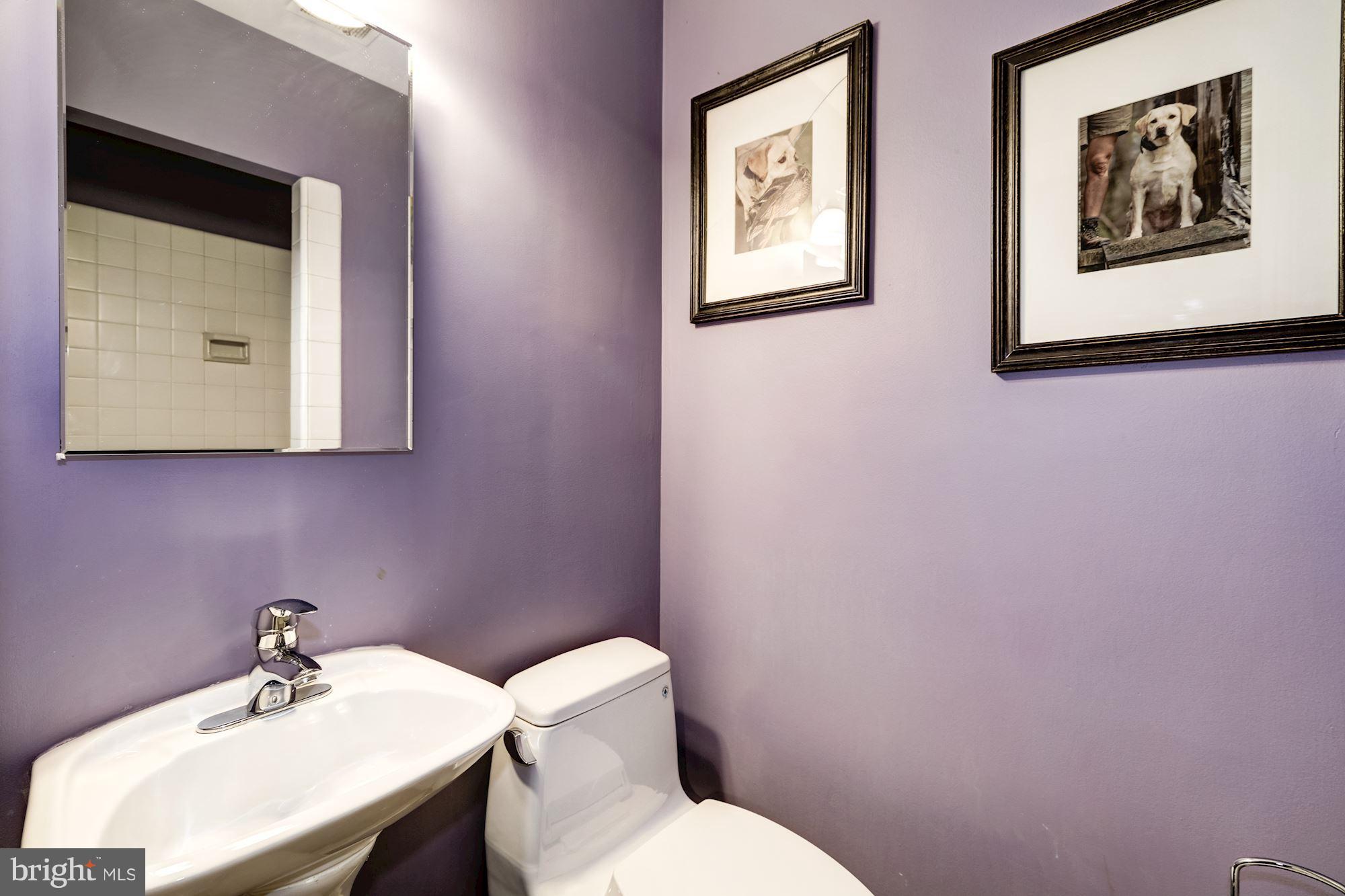 4767 Berkeley Terrace Northwest Washington, DC 20007 - Photo 27 of 30 a bathroom with a toilet sink and mirror