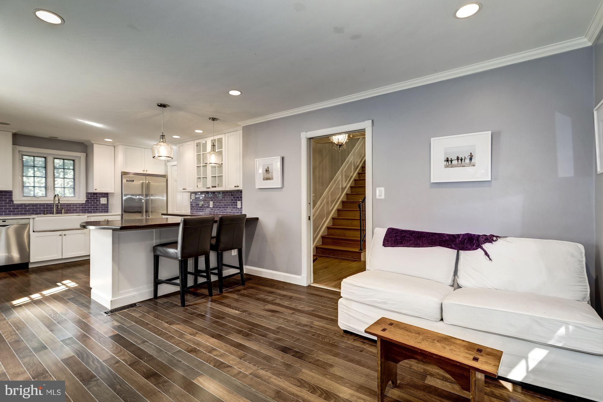 4767 Berkeley Terrace Northwest Washington, DC 20007 - Photo 7 of 30 a living room with furniture and a dining table with wooden floor
