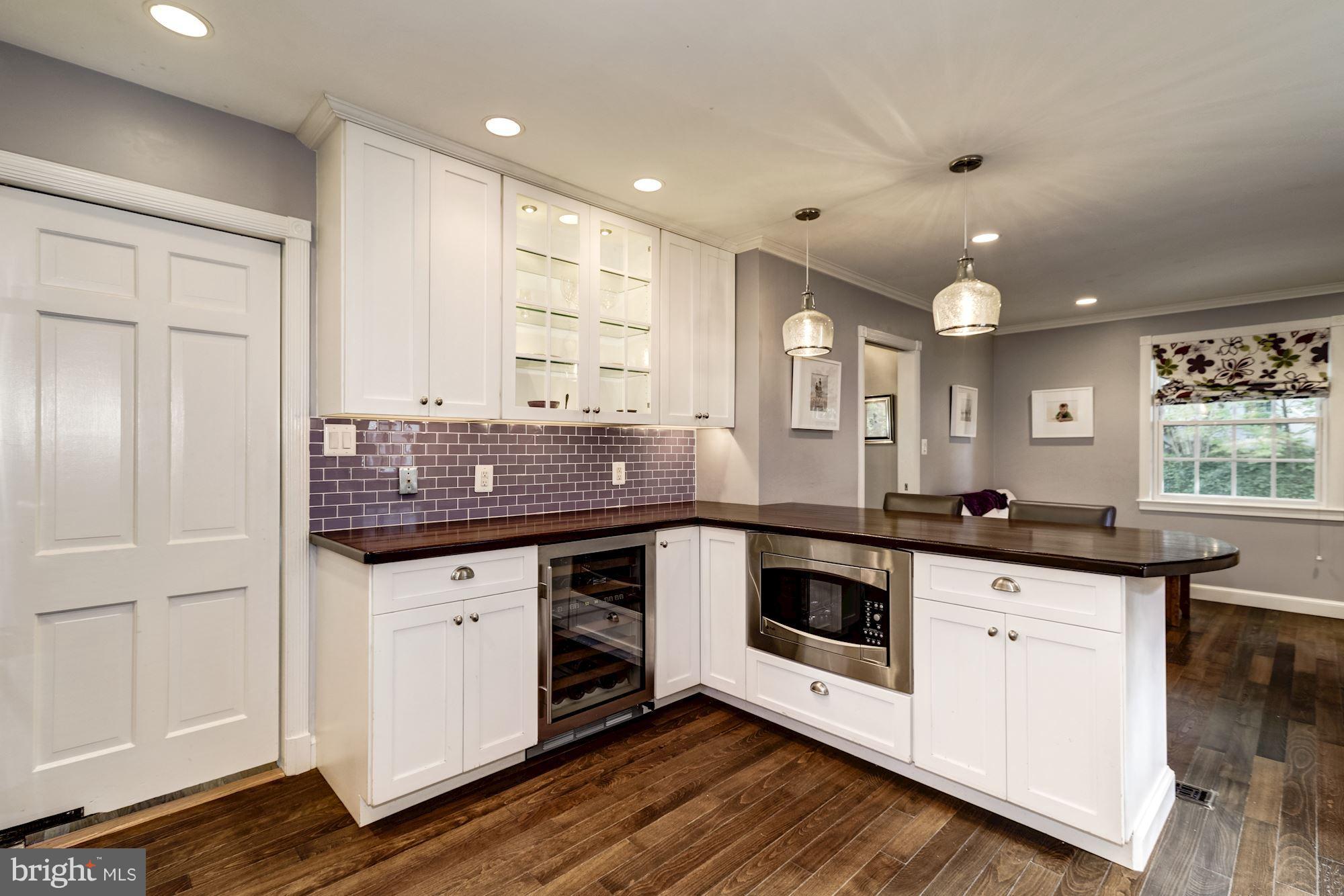 4767 Berkeley Terrace Northwest Washington, DC 20007 - Photo 9 of 30 a kitchen with granite countertop a sink and cabinets