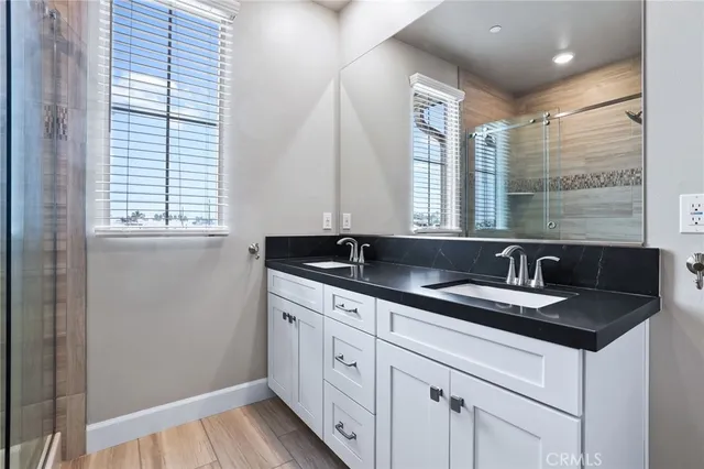 a kitchen with granite countertop a sink and a window