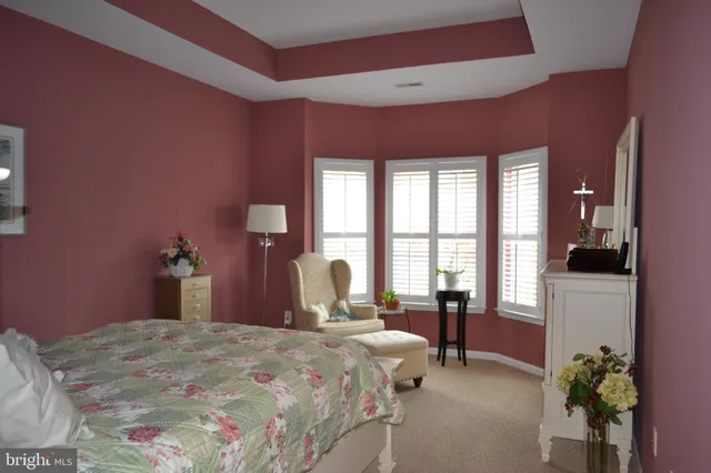 a bathroom with a sink a toilet and a window
