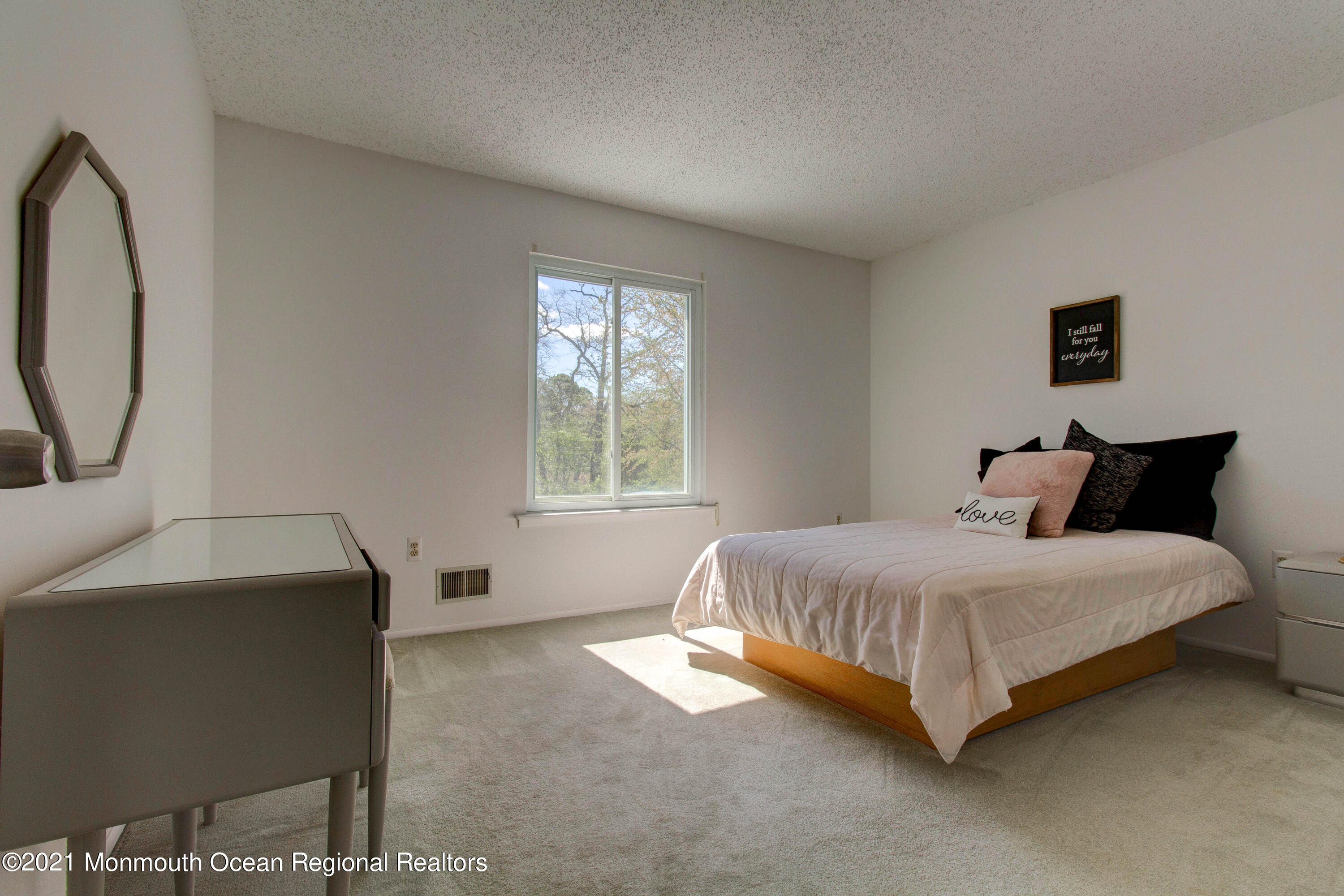 107 Reflection Road Toms River, NJ 08753 - Photo 23 of 29 a bed sitting in a bedroom next to a window