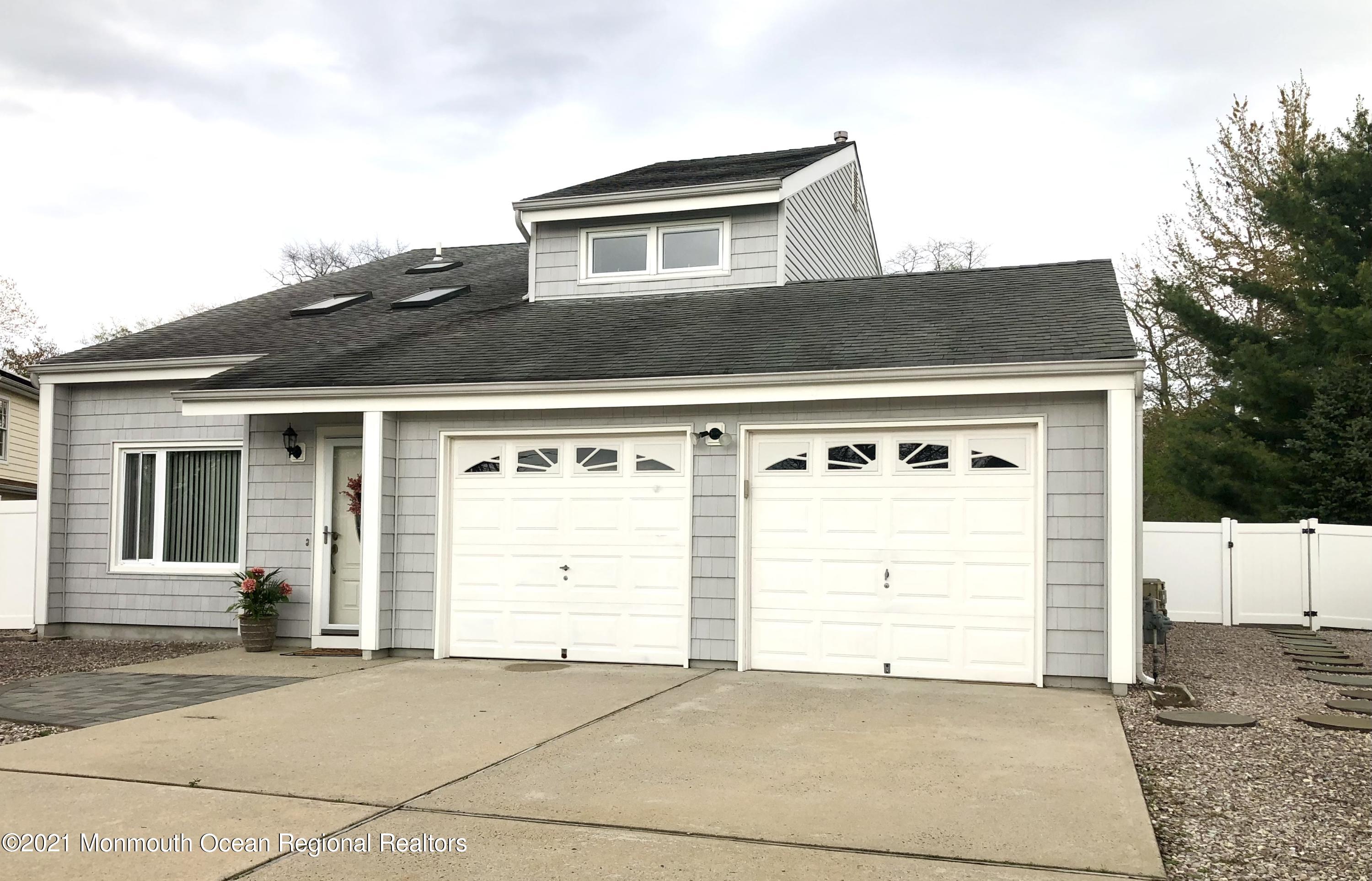 107 Reflection Road Toms River, NJ 08753 - Photo 4 of 29 a front view of a house with a garage