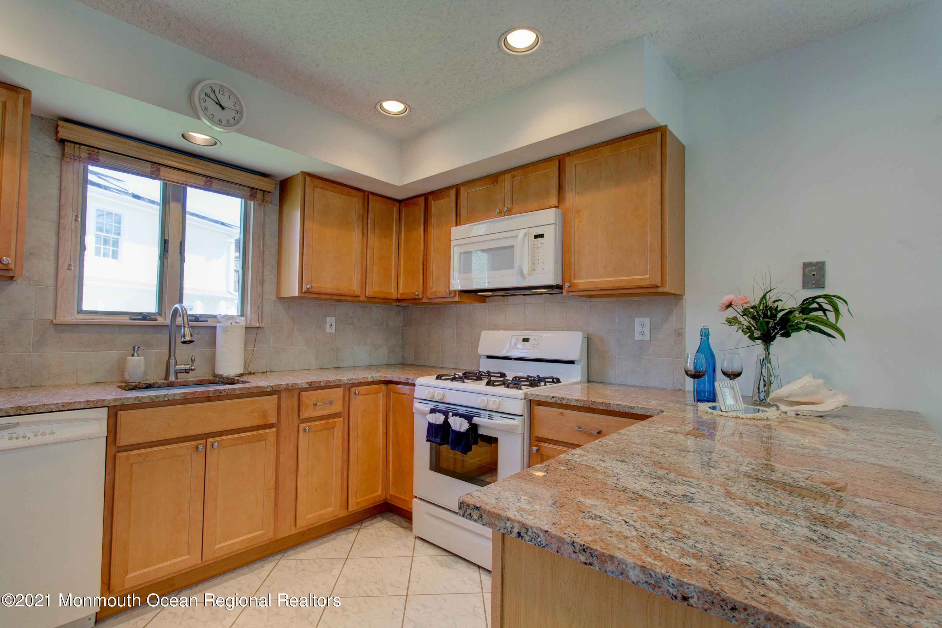 107 Reflection Road Toms River, NJ 08753 - Photo 9 of 29 a kitchen with a sink stove and cabinets