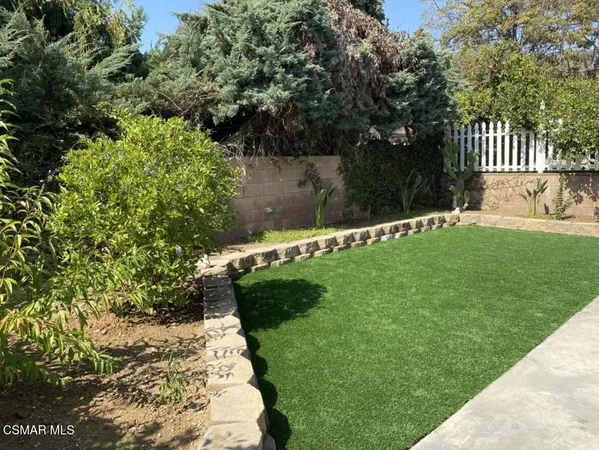 a view of a back yard of a house