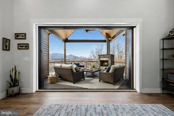 a bed room with furniture and a flat screen tv