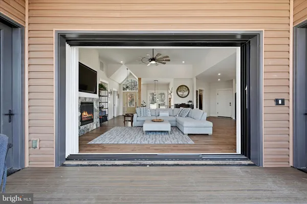 a view of a living room with a fireplace