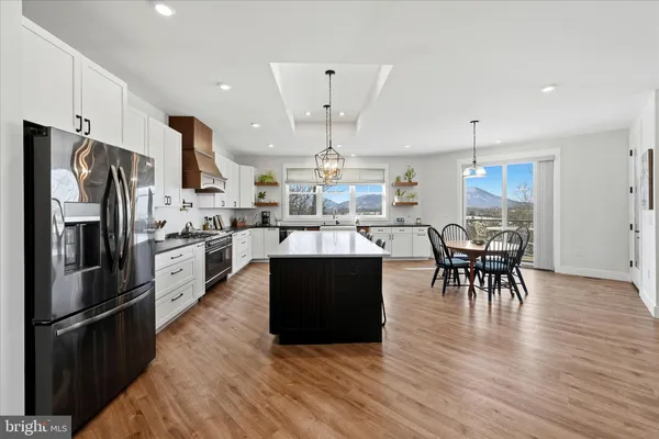 a bathroom with a sink vanity and mirror