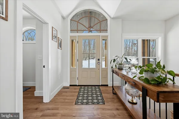 a living room with fireplace furniture and a flat screen tv