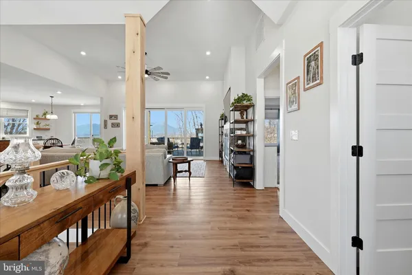a living room with furniture and a painting on the wall