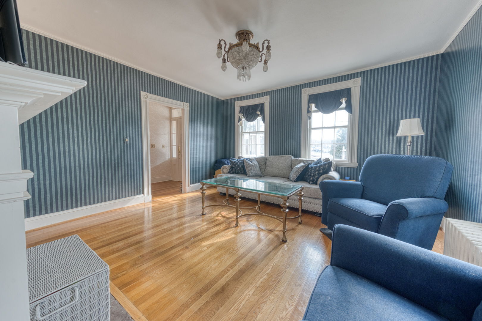 89 Maple Street Ellington, CT 06029 - Photo 13 of 40 a living room with furniture and a chandelier
