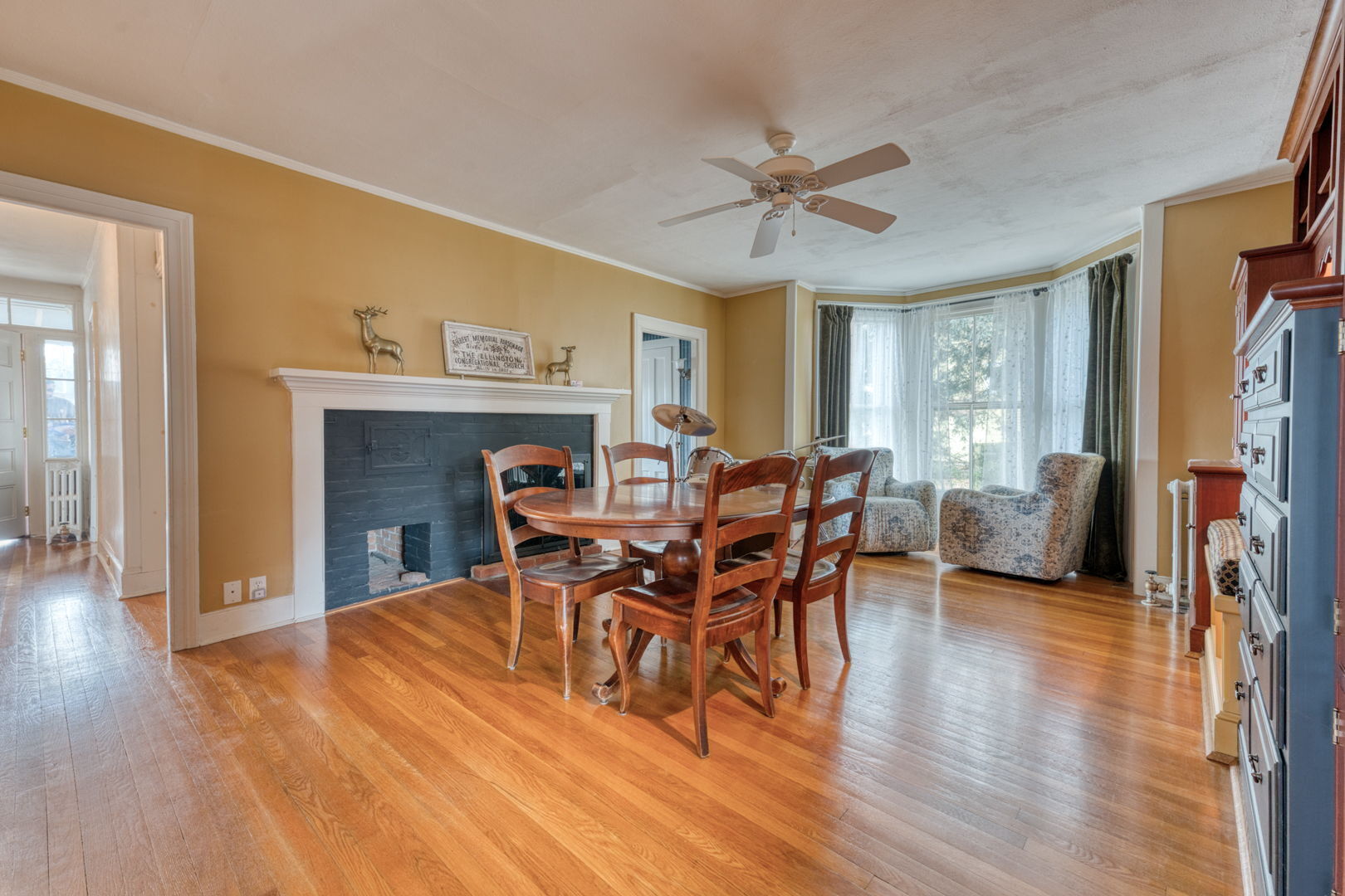 89 Maple Street Ellington, CT 06029 - Photo 15 of 40 a view of a dining room with furniture and wooden floor