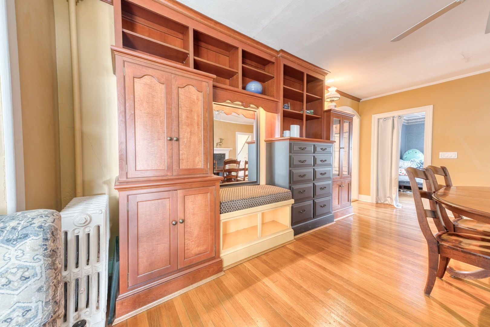 89 Maple Street Ellington, CT 06029 - Photo 16 of 40 a spacious bedroom with a large bed and a chandelier