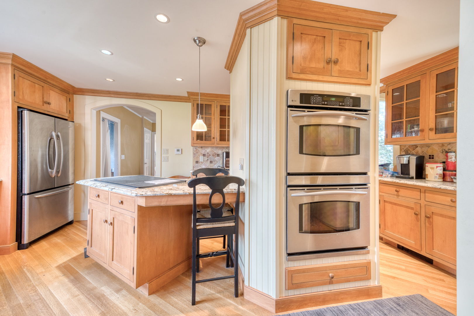 89 Maple Street Ellington, CT 06029 - Photo 21 of 40 a kitchen with stainless steel appliances granite countertop a stove and a refrigerator