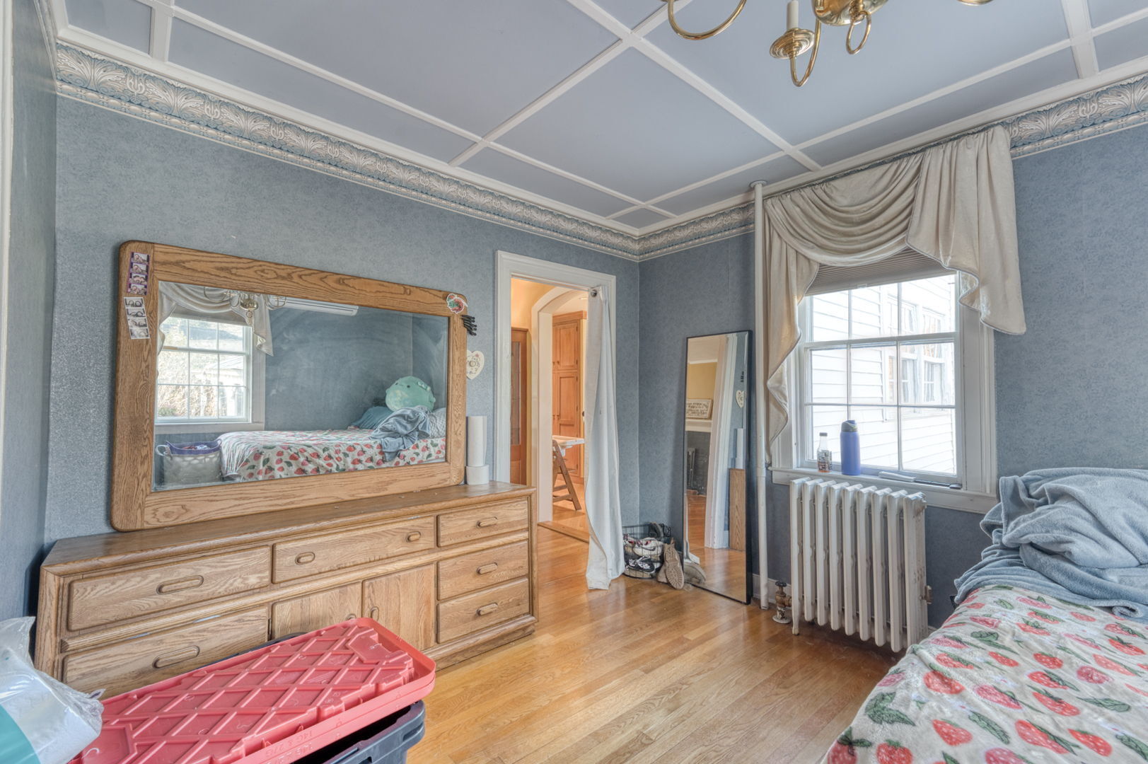 89 Maple Street Ellington, CT 06029 - Photo 22 of 40 a bedroom with a bed and wooden floor