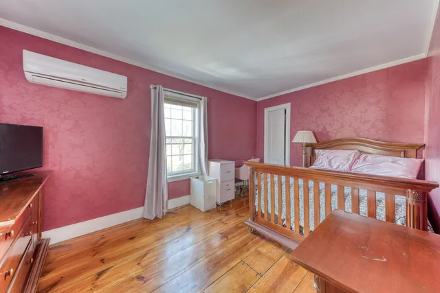 a bathroom with a double vanity sink toilet and shower