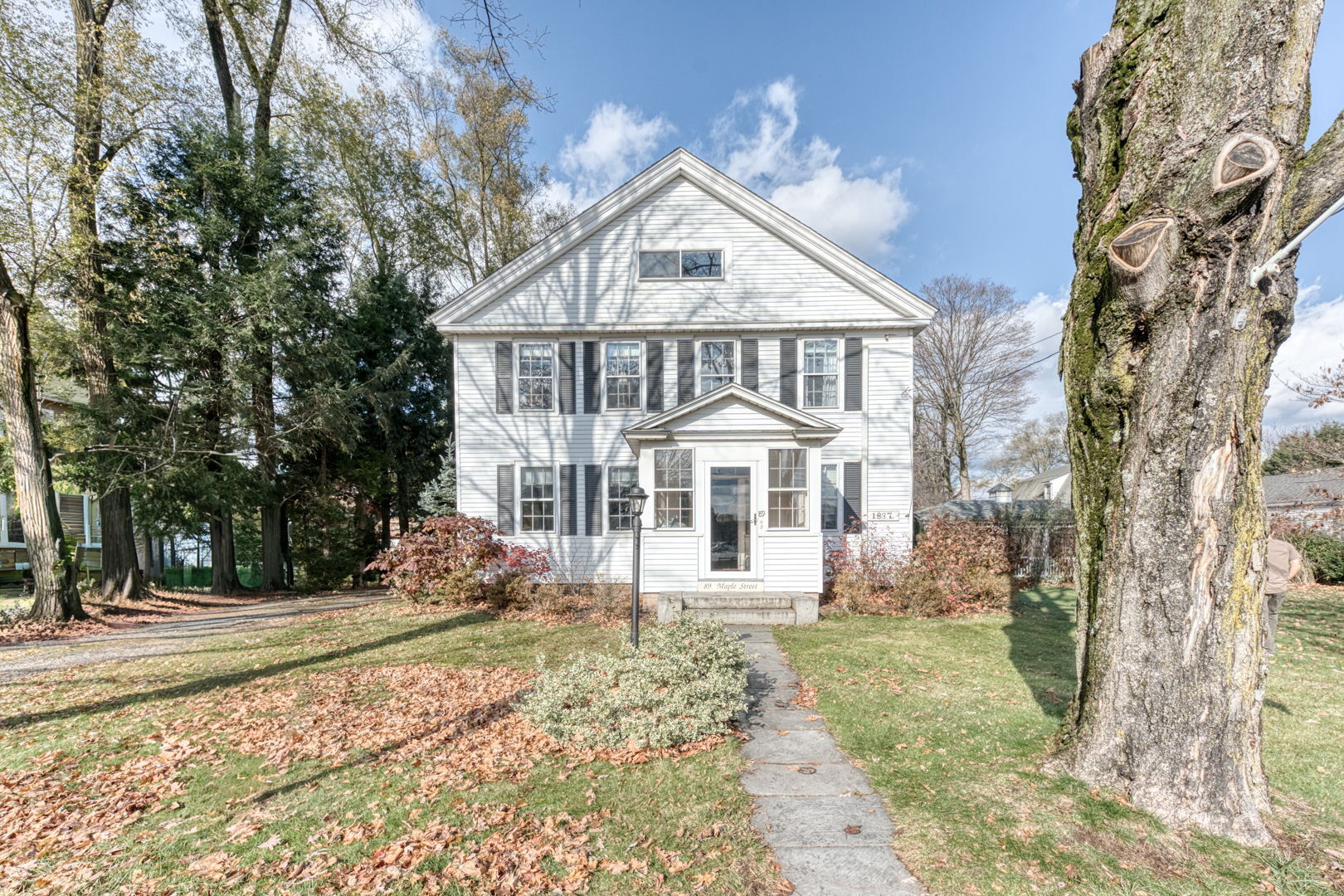 89 Maple Street Ellington, CT 06029 - Photo 33 of 40 a front view of a house with a yard