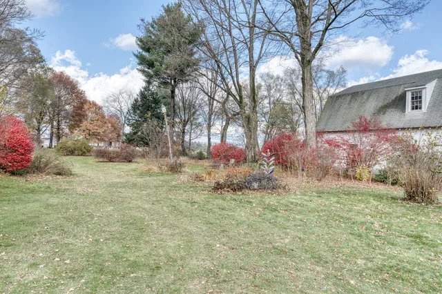 a backyard of a house with lots of green space