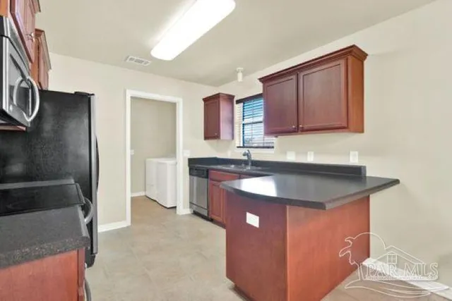 a bedroom with furniture and a large window