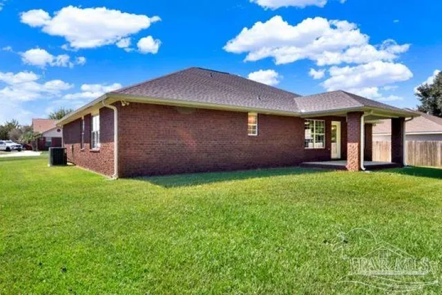 a kitchen with stainless steel appliances granite countertop sink stove top oven and cabinets
