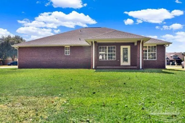 a kitchen with granite countertop a refrigerator stove and microwave