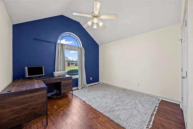 a view of a livingroom with furniture window and wooden floor