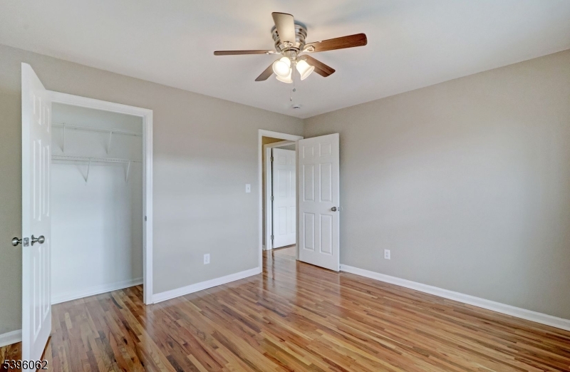 12 Edwin Street Carteret, NJ 07008 - Photo 15 of 20 a view of an empty room with wooden floor