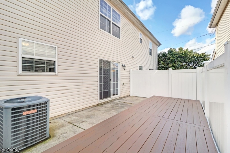 12 Edwin Street Carteret, NJ 07008 - Photo 19 of 20 a view of a house with a wooden deck