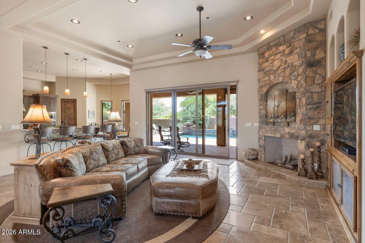 18507 East Picacho Road Rio Verde, AZ 85263 - Photo 11 of 33 a living room with furniture and a flat screen tv