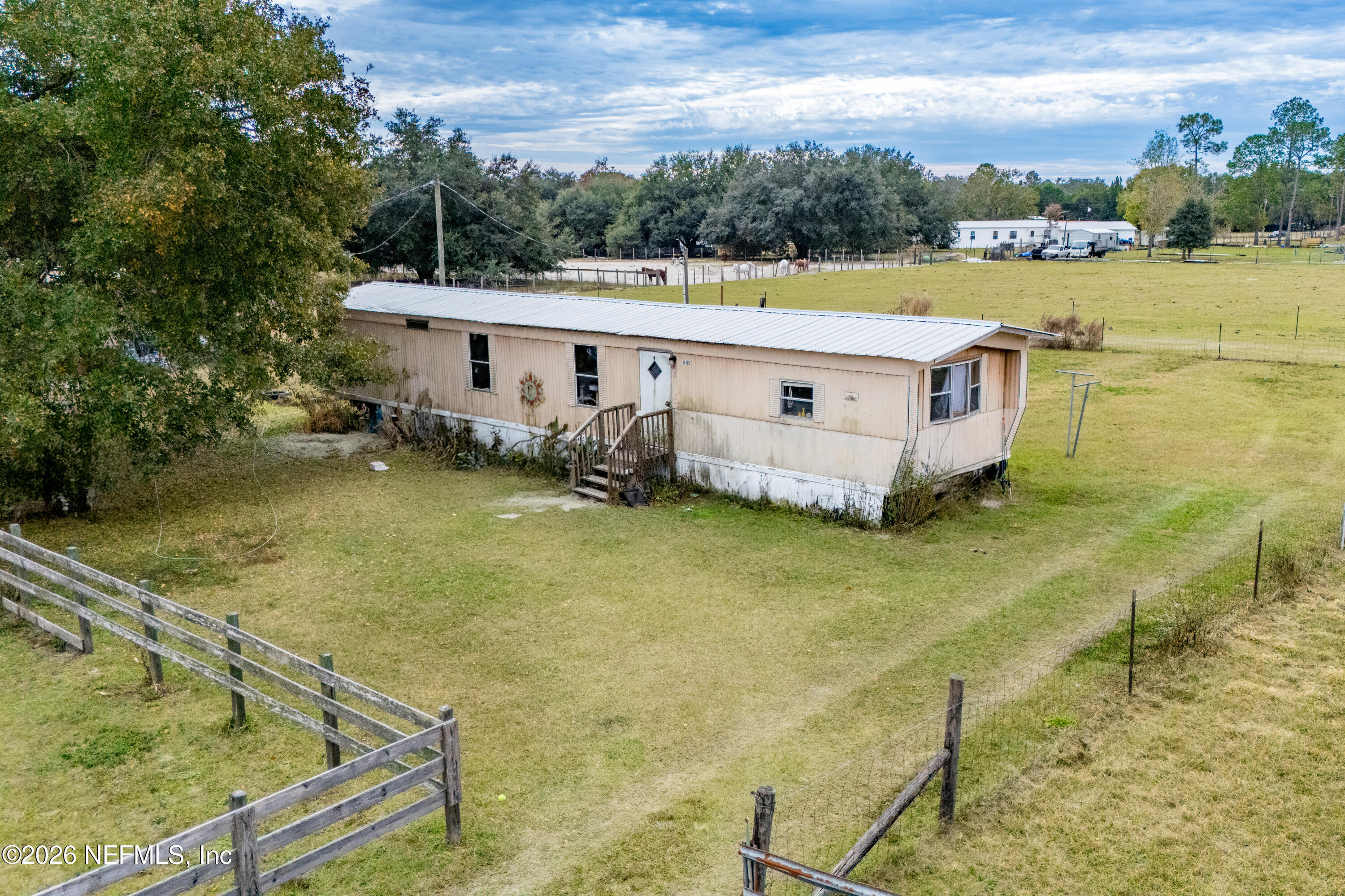 10427 Southwest 113th Avenue Brooker, FL 32622 - Photo 3 of 7 a view of a house with a swimming pool
