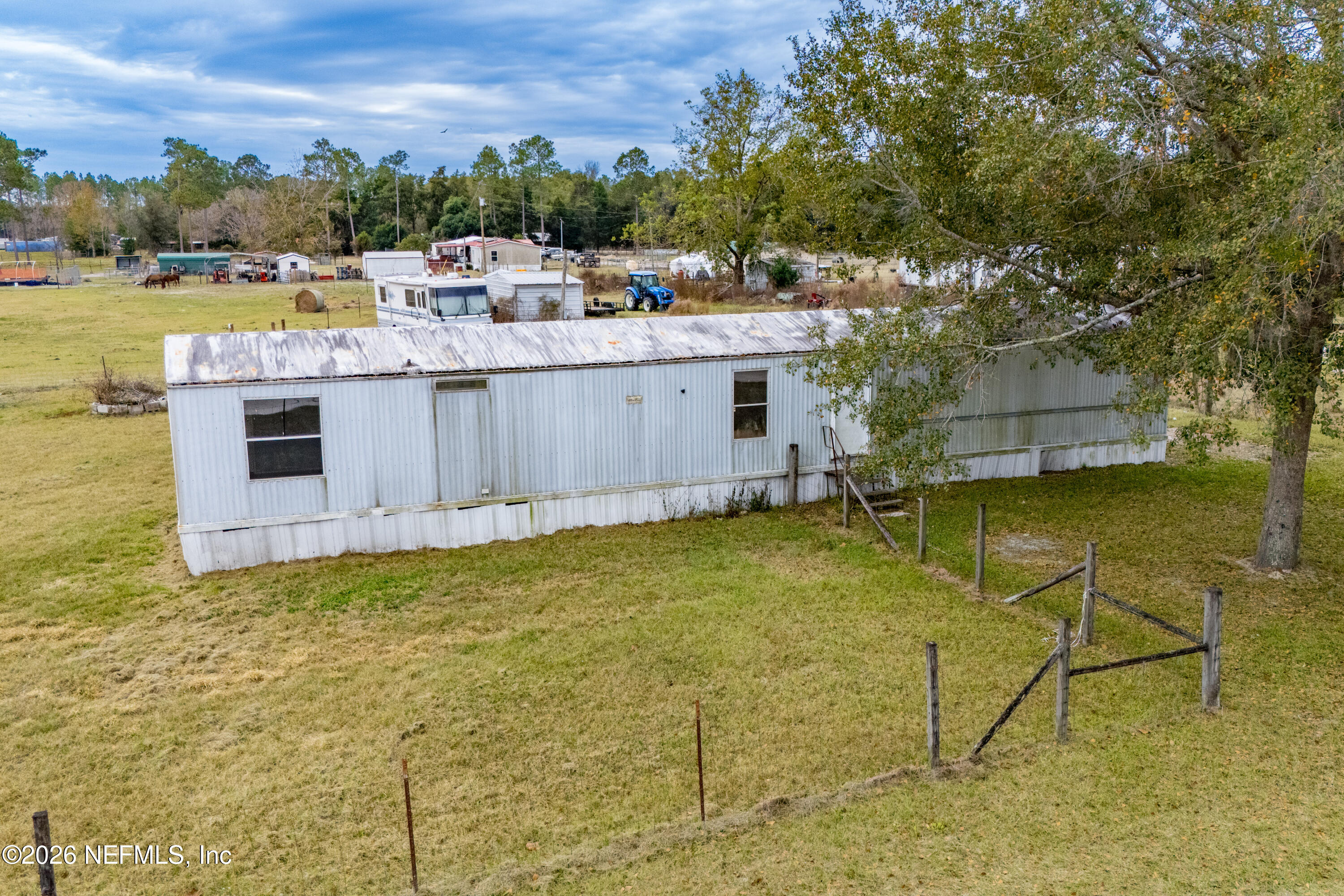 10427 Southwest 113th Avenue Brooker, FL 32622 - Photo 5 of 7 a view of a swimming pool with a lake view